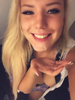 Beautiful blonde taking a selfie after a facial