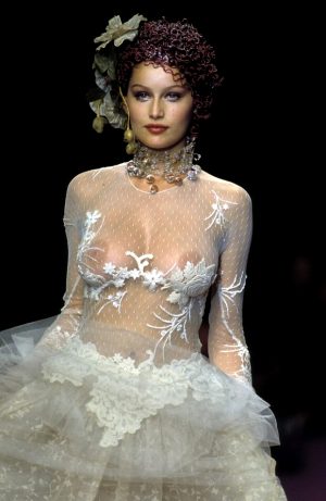 French actress and model Laetitia Casta nude boobs under see through dress runway photo