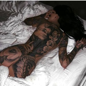 laying tatted chick