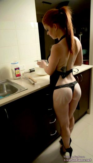 Sexy wife cooking after the beach.